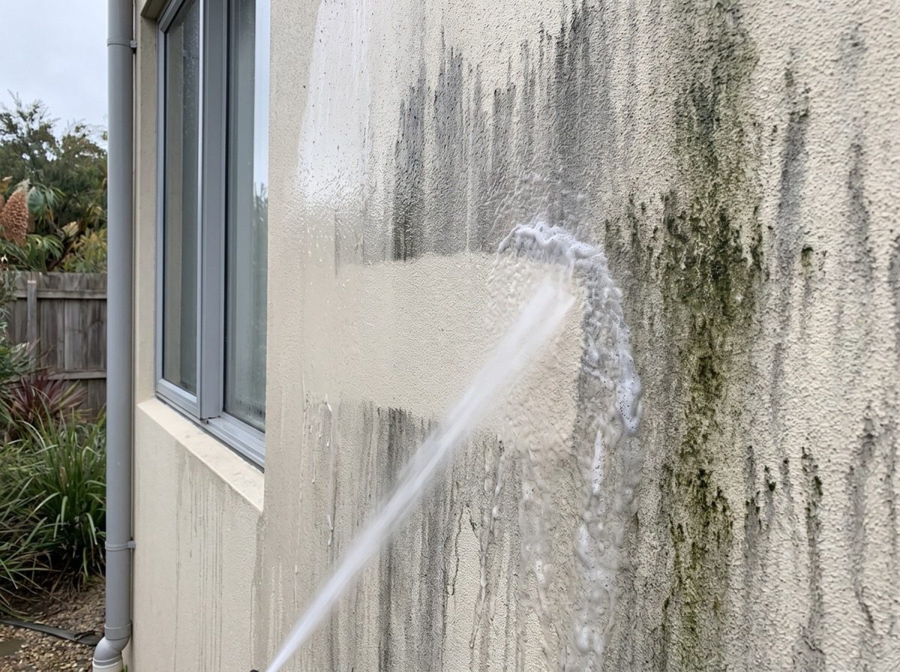 Close texture of a pressure-washed rendered wall